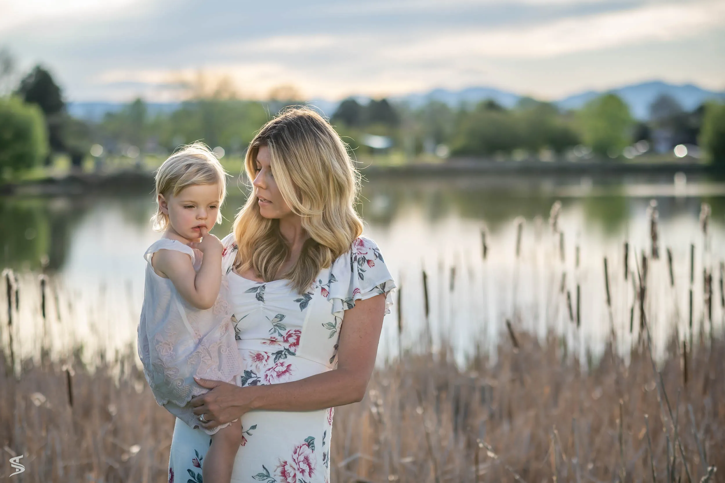 Mother and baby beside a lake