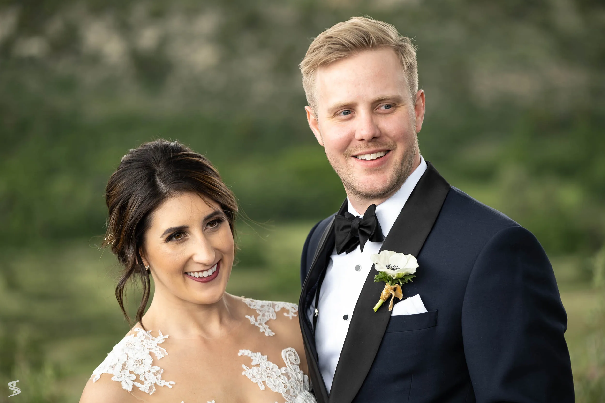 Close-up portrait of the smiling bride and groom at their destination wedding at Garden of the Gods, Colorado.